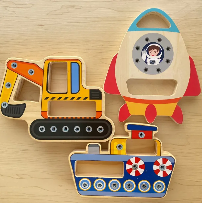 wooden_busy_board_set_of__0.webp Wooden Busy Board Set of 3 ( Airplane, Boat and Digger)- The best fine motor toys